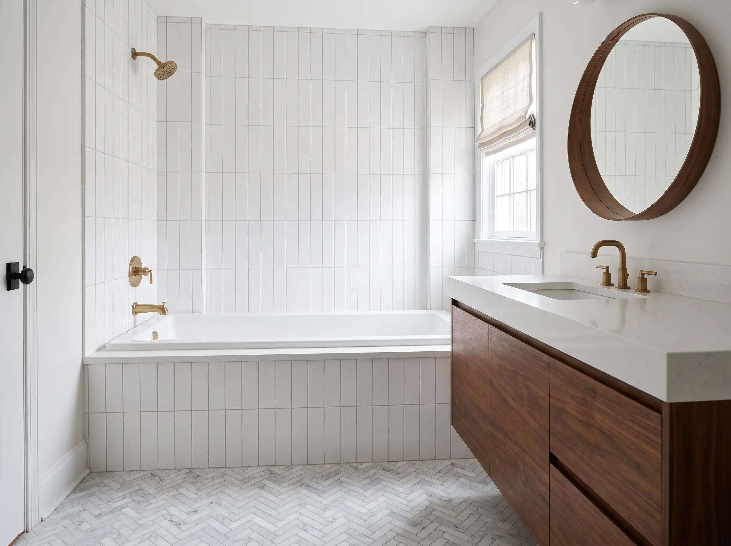 Remodeled bathroom with herringbone marble tile floor
